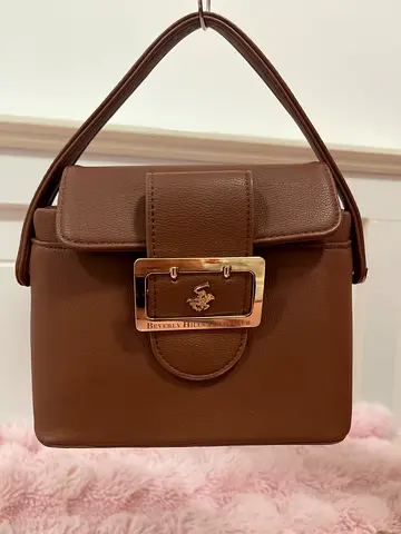Brown leather shoulder bag with gold buckle - medium size