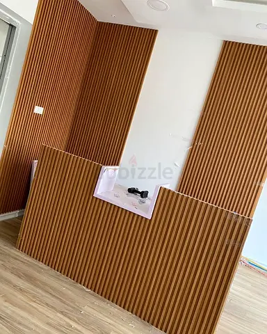 Modern Custom Reception Desk with Vertical Fluted Wood Paneling, Black Groove Details and Contempora