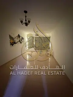 An apartment is available in Al Qasimia (Al Nad) featuring two master bedrooms, a living room with a