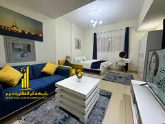 Largest furnished studio apartment with separate kitchen and open view for monthly rent in Ajman - A