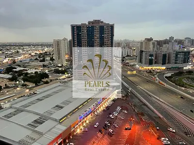 2BR apartment for sale in Concord Tower Ajman, 1600 sq ft, city and creek view, ready handover, AED