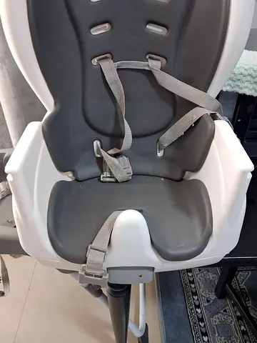 Used baby high chair insert with safety harness