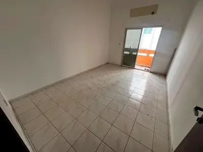 ✨ Two-bedroom apartment with a living room, two bathrooms, and a balcony, second row from Ajman Corniche ✨
