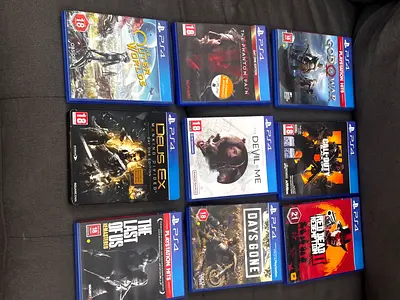 Collection of 9PS4 Games Including Red Dead Redemption 2 and $%& of War