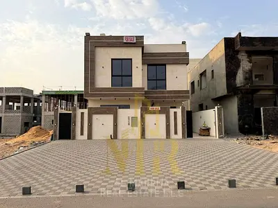 Modern villa for sale with luxurious finishes and upscale modern specifications, two floors and a r