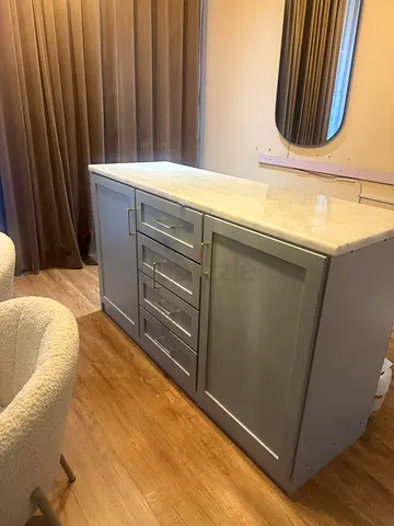 Gray table with marble top and drawers