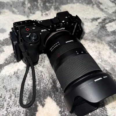 Sony mirrorless camera with Tamron 17-70mm f2.8 lens and accessories