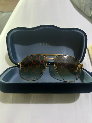 Gucci gold-frame sunglasses with branded case - new