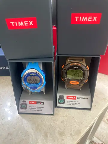 Two Timex digital sport watches (men's and children's) in original boxes