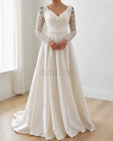 Ivory long-sleeve satin wedding dress with lace bodice and full skirt
