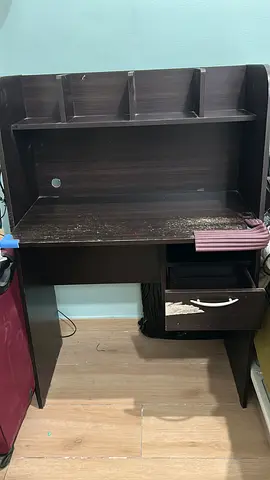 Dark wood corner computer desk with shelves and drawer