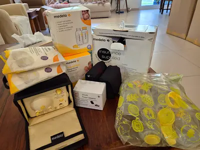 Medela Pump & Accessories Bundle — Double Electric Breast Pump with Parts including extra battery