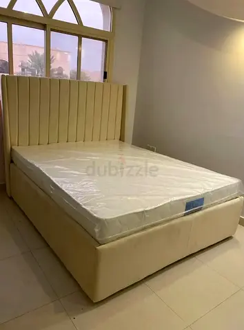Upholstered King Bed with Tall Padded Headboard and Storage Base