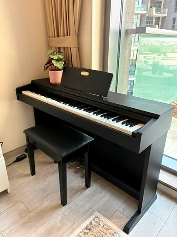 Pearl River Piano with bench - great condition