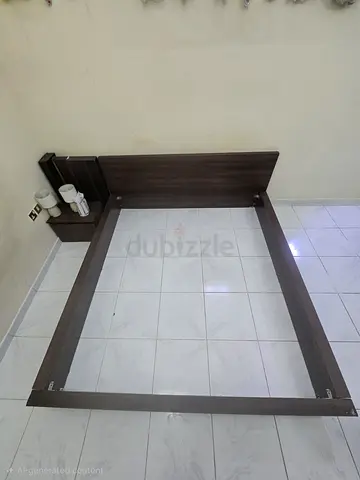 King size wooden bed with spring mattress