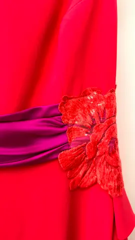 Red evening dress with purple sash and floral applique, size unknown