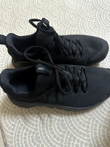 Black Nike casual sneakers, lightly used, size not specified