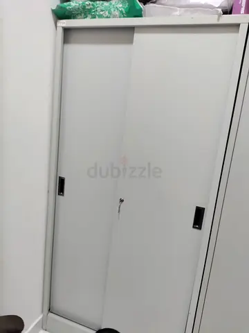 URGENT SALE FOR SILVER CABINET WITH SLIDING DOOR