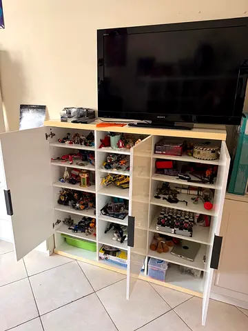 White multi-shelf storage cabinet with doors — good condition