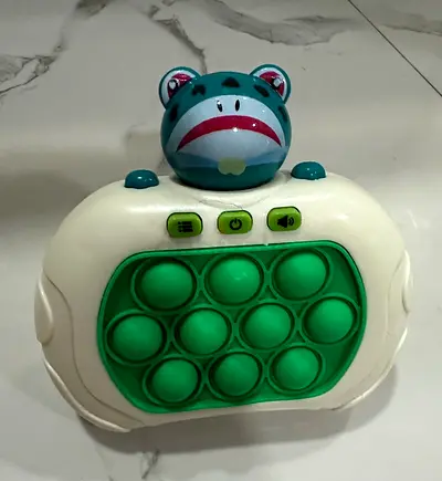 Small interactive pop-it toy with music light-up frog topper - Mint condition as New