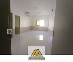 2BR in Al Rawda 2, balcony, 2 baths, divided kitchen, split AC, free maintenance, AED 37,997/year.