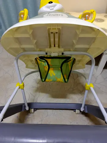 Used baby high chair with toy bar and storage pouch - good condition