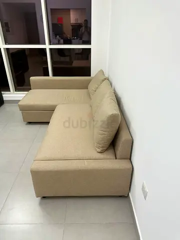 Beige L-shaped Sofa bed with Chaise - Good Condition