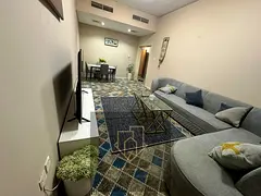 For monthly rent - Two bedrooms and a living room, fully furnished | Prime location - Al Rashidiya 3