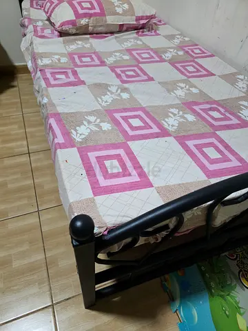 Single black metal bed frame with mattress and bedsheet - good condition