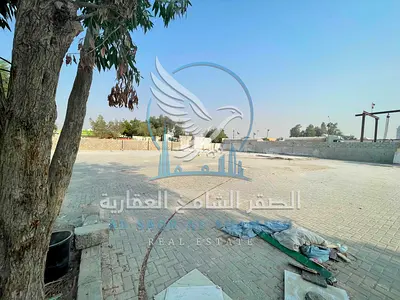 Exceptional Industrial Yard in Al Sajaa | 20,000 Sq. Ft. Corner Plot | 50 kVA Power | Ideal for Industrial & Commercial Use