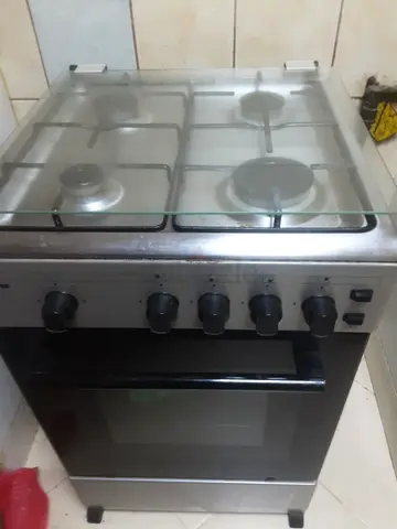 Used freestanding gas cooker with 4 burners and oven - stainless steel