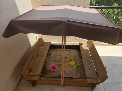 Child's sandbox with shade cover