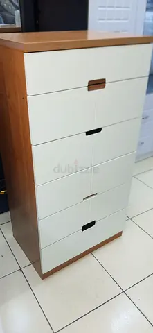 Tall wooden storage cabinet with multiple drawers/doors - good condition