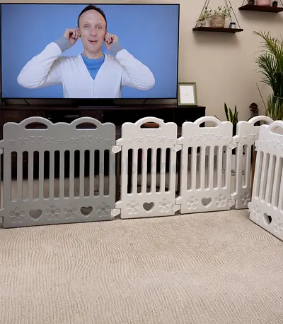 Baby playpen with fence with a basket ball hoop