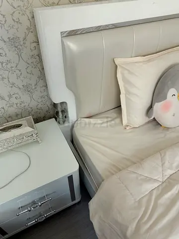 Modern white upholstered bed frame with matching nightstand (good condition)