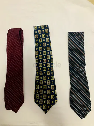 Three men's premium ties - burgundy, patterned navy, and grey striped, good used condition