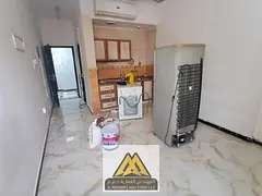 Shared studio for bachelors in Al Rawda 3, split AC, no elevator, AED 17,000 annually, payable in 4