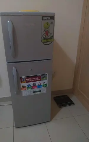 Silver top-freezer refrigerator - good working condition