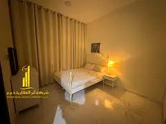 Furnished 2-bedroom apartment for monthly rent in Ajman, including utilities, internet, and parking.