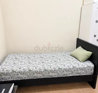 Single black wooden bed frame with mattress - good condition