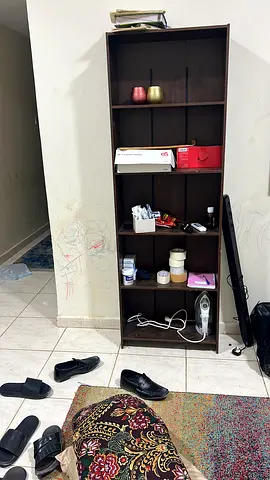 Tall dark wood bookcase/shelving unit — good condition