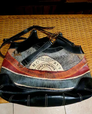 Gattinoni black leather shoulder bag with patterned front panel. New. Never Worn. AED. 300 only!