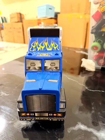 Blue toy semi-truck with flame decal - including cars