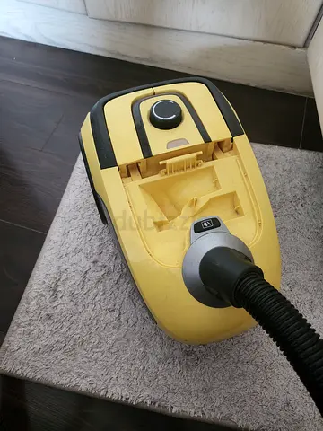 Used yellow canister vacuum cleaner - working condition