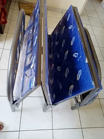 Foldable single metal guest bed with mattress (like new)
