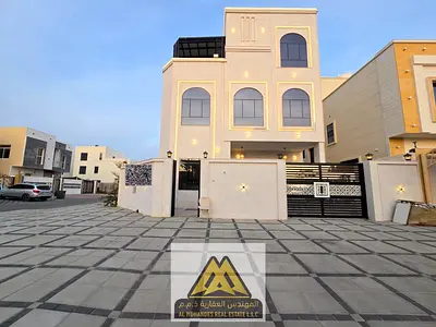 Luxury villa for sale in Al Amra, 7 master bedrooms, majlis, living room, roof, premium finishes, AED 2.25M.