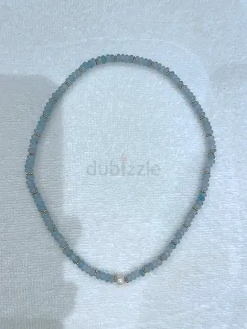 Light blue beaded gemstone necklace with small spacer beads