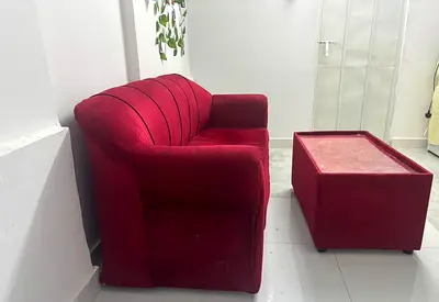 Red Velvet 2-Seater Sofa with Matching Ottoman - Good Condition