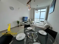 Furnished one-bedroom apartment with sea view, brand new furniture, for monthly rent in Ajman - Corn