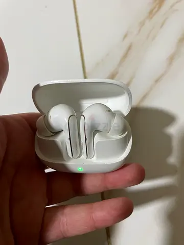 Used white true wireless earbuds with charging case - working